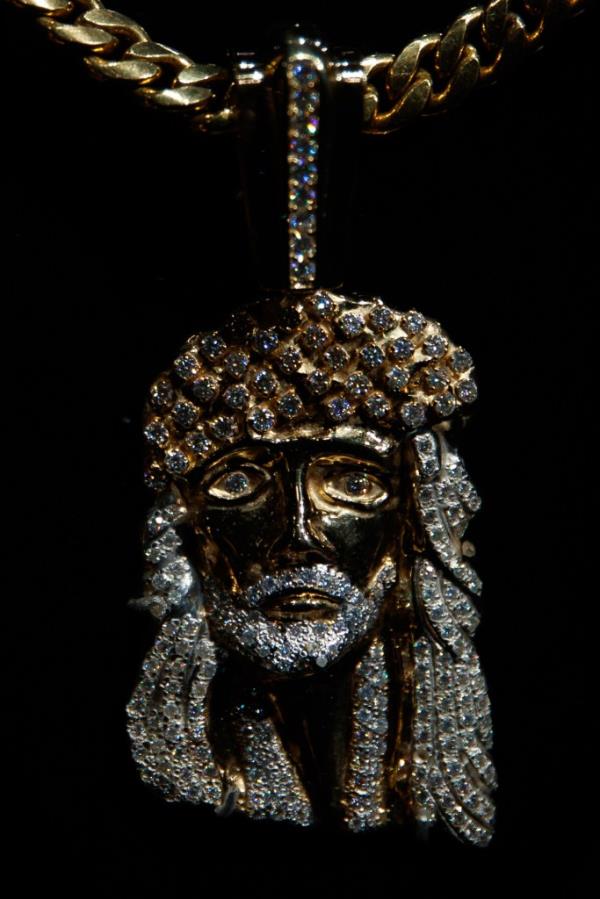 Diamond-studded Jesus piece necklace created by Tito Caicedo, displayed at the 'Ice Cold: An Exhibition of Hip-Hop Jewelry' at the American Museum of Natural History