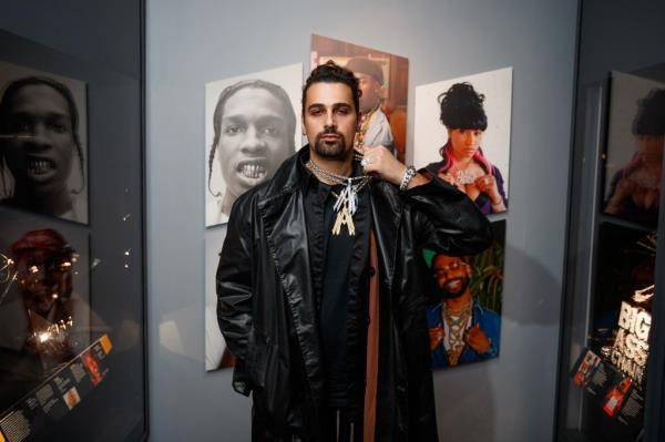 Alex Moss presenting his hip-hop jewelry inspired by Tyler, The Creator's Grammy Bellhop look at the American Museum of Natural History exhibit.