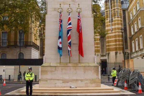 Police officers guard The Cenotaph as fears grow that the war memorial will be vandalised ahead of Armistice Day. Police officers guard The Cenotaph ahead of Armistice Day, London, England