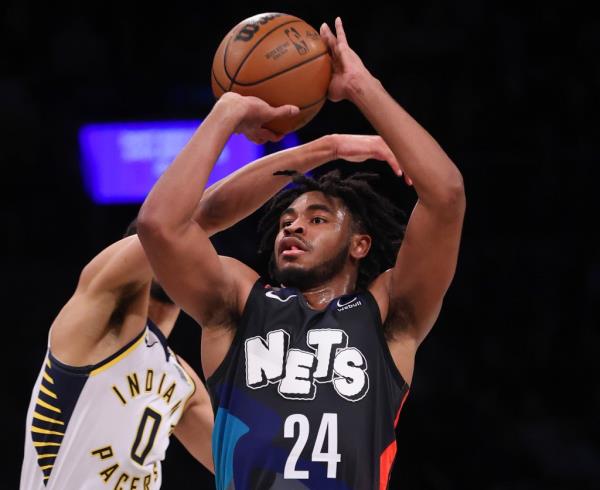 Cam Thomas, who scored a game-high 27 points, puts up a jumper as Tyrese Haliburton defends during the Nets' win. 