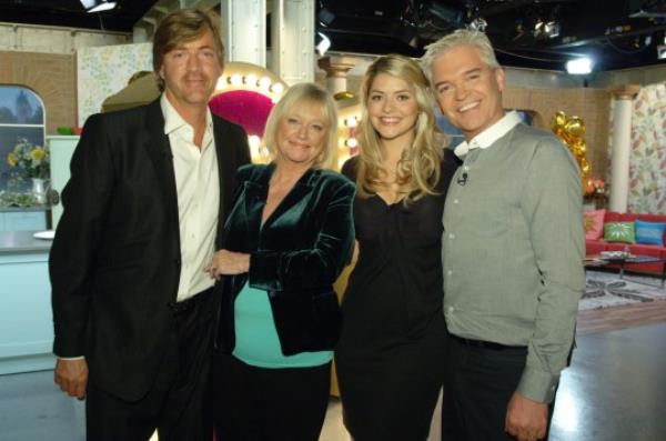Editorial use o<em></em>nly Mandatory Credit: Photo by Kieron Mccarron/ITV/REX/Shutterstock (1012560b) Richard Madeley, Judy Finnigan, Holly Willoughby, Phillip Schofield. 'This Morning' TV Programme. 21st Anniversary. - 05 Oct 2009 Richard and Judy returned to the 'This Morning' sofa today to celebrate the show's 21st anniversary. The couple, who co-hosted the show for 13 years, appeared alo<em></em>ngside current presenters Phillip Schofield and Holly Willoughby.