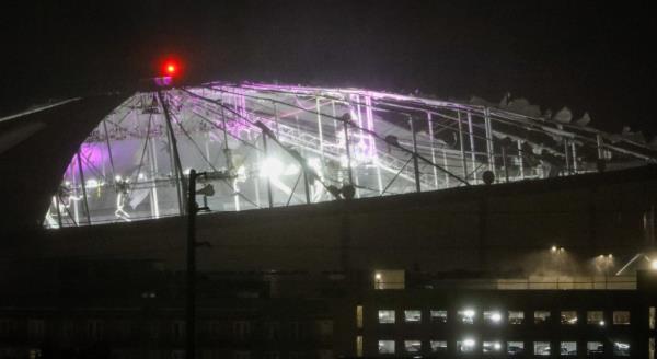 The stadium's lighting system and roof supports beams were visible from the outside.