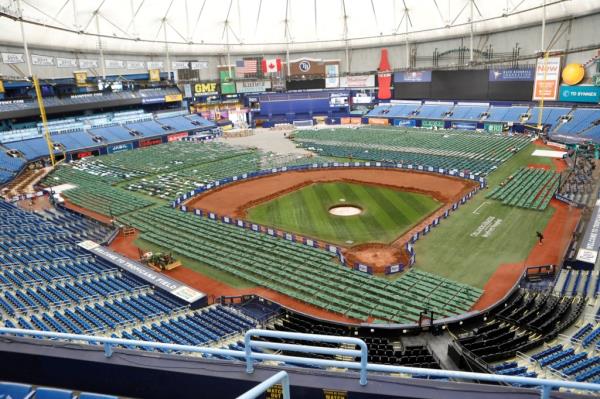 Thousands of green and white cots had been set up in the outfield and foul territories to accommodate the workers and operations crews. 