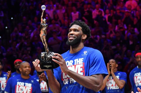Philadelphia 76ers center Joel Embiid (21) with the MVP trophy before game three of the 2023 NBA playoff against the Boston Celtics at Wells Fargo Center.