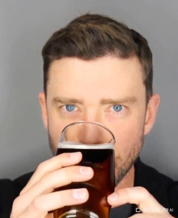 The AI-generated clip shows Justin Timberlake chugging a beer in his now infamous mugshot.