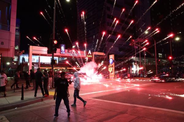 Los Angeles Dodgers fans are seen setting of fireworks and celebrating in the streets after the World Series win.