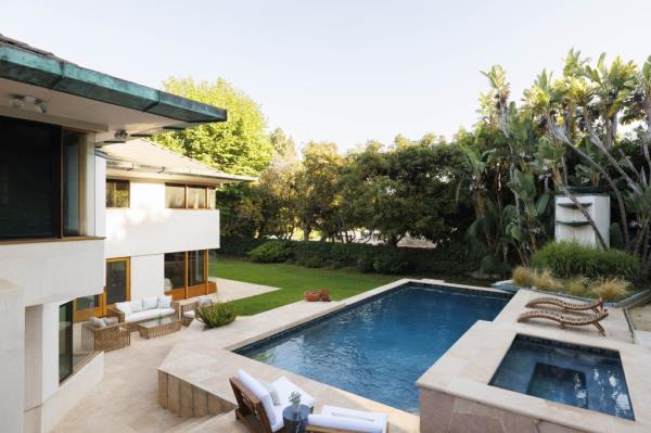 The private estate sits on 1.61 acres and features a pool.