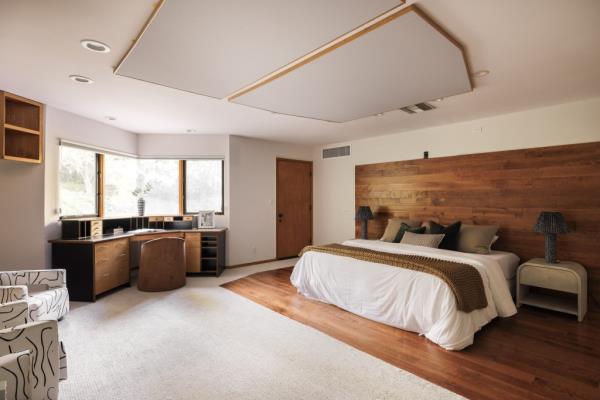 The main bedroom features an alcoved work space.