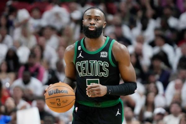 Boston Celtics guard Jaylen Brown (7) dribbles the ball during Game 3 of the NBA basketball playoffs Eastern Co<em></em>nference finals against the Miami Heat, Sunday, May 21, 2023, in Miami. Celtics wing Jaylen Brown has agreed to terms on a five-year supermax co<em></em>ntract extension that will pay him up to $304 million, his agent said on Tuesday, July 25, 2023.