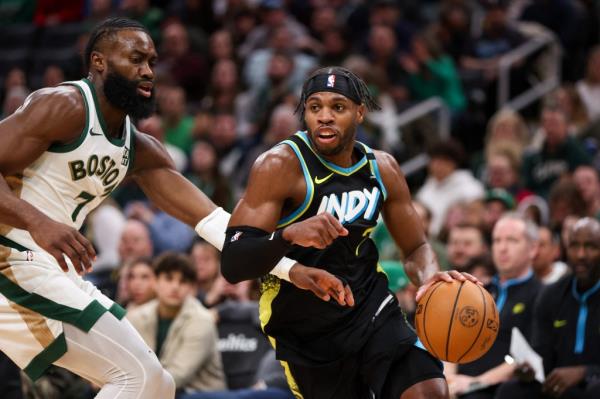 Indiana Pacers forward Buddy Hield (7) drives to the basket defended by Boston Celtics forward Jaylen Brown (7) during the first half at TD Garden.