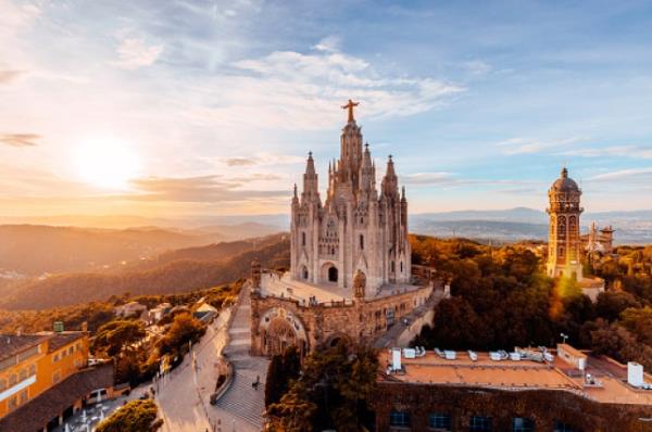 Tibidabo mountain and Sagrat Cor church at sunset, Barcelona, Spain