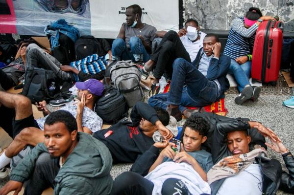 Migrants wait outside of the former Roosevelt Hotel in New York, New York USA, 01 August 2023. 