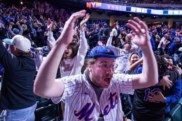 Mets fans celebrate from a watch party at Citi Field on Oct. 3.