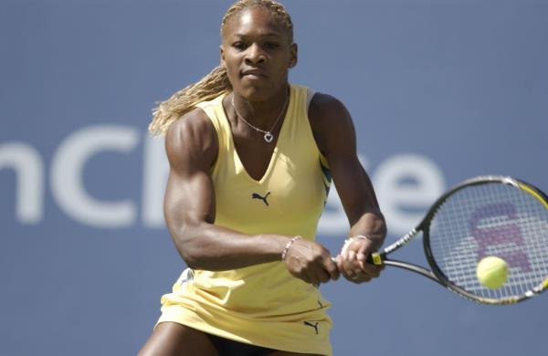 Serena Williams returns a shot to   Martina Hingis of Switzerland during the semifinals of the US Open in 2001.