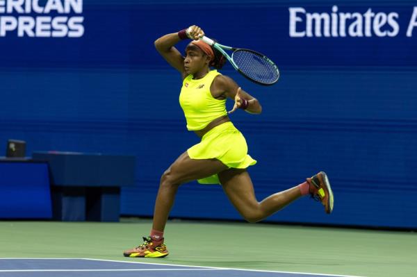 Coco Gauff returns a volley against Carolina Muchova as they play the women's single semifinal.