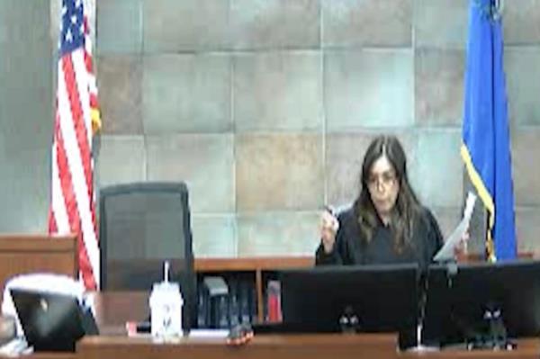 Clark County District Court Judge Bita Yeager looks on as court officers break up the two men on Feb. 1.