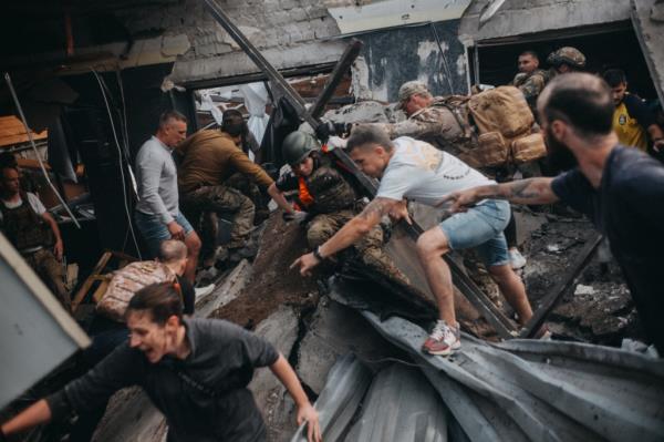 Search and rescue efforts at the site of the RIA missile strike.