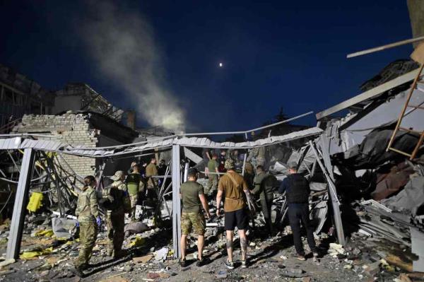 Rescuers and volunteers work to rescue people from under the rubble.