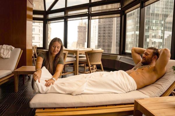 Image of Devlin massaging McGregor's feet.