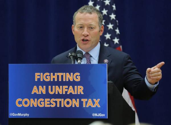 Rep. Josh Gottheimer spoke as New Jersey Governor Phil Murphy signed a bill with the support of a delegation of politicians representing the Garden State, who came to Fort Lee to announce a lawsuit against the city of New York for imposing a co<em></em>ngestion tax