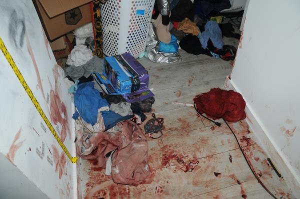 Blood covers the floors of Clenney's apartment following the stabbing on April 3, 2022.
