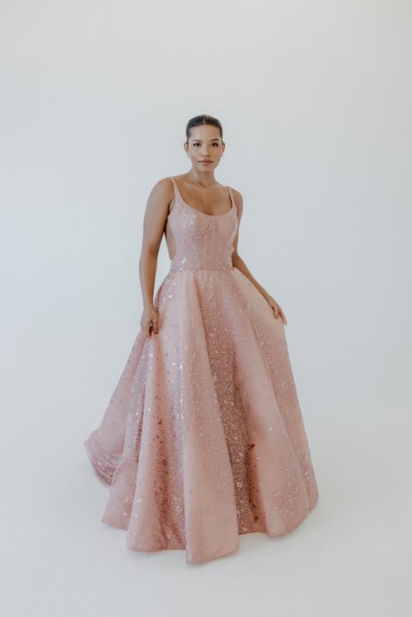 The sparkling foil fabric on Brea by Elizabeth Lee features a corseted bodice with a scoop neckline and full skirt. 