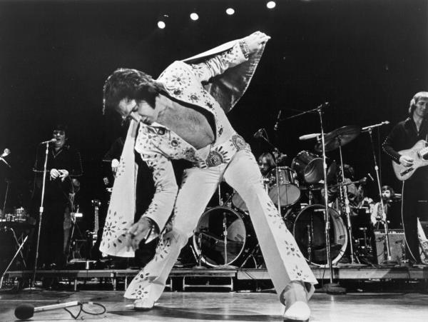 Rock and roll singer Elvis Presley performs on stage in 1972.