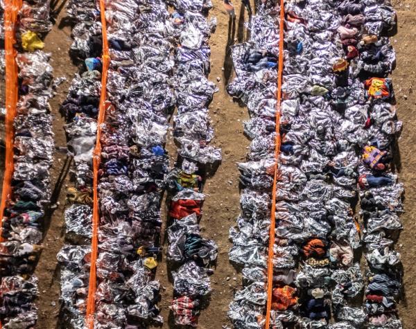 Thousands of migrants wait to be processed by the U.S. Border Patrol at a make-shift transit center.