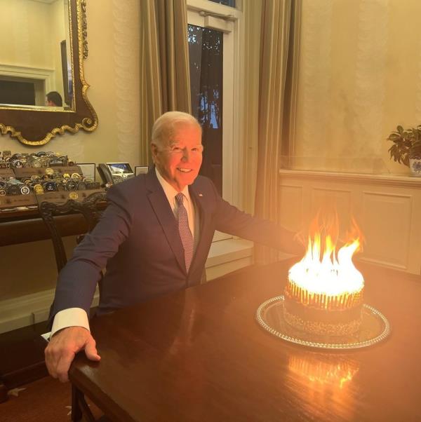 Joe Biden has been mocked after posting a photo of himself in front of a blazing birthday cake