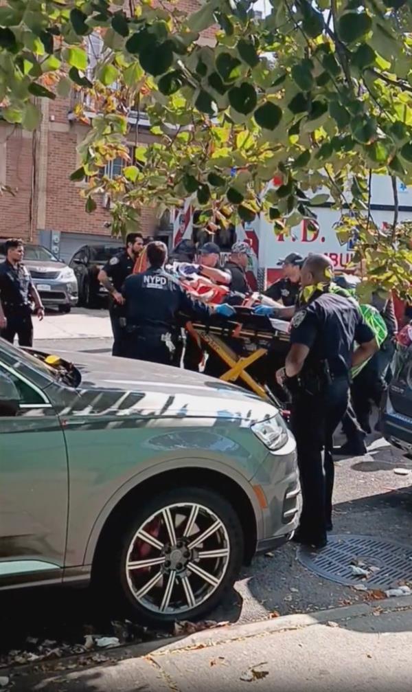 A person getting rushed to an ambulance at the scene of a shooting in Brownsville, Brooklyn on Sept. 15, 2024.
