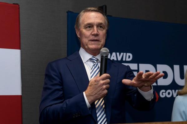 Republican gubernatorial candidate David Perdue speaking to supporters at an election-night event in Atlanta, Georgia, holding a microphone
