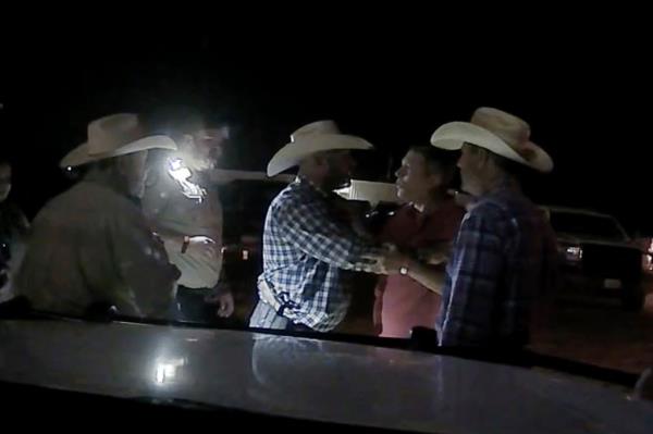Co<em></em>ngressman Ro<em></em>nny Jackson is seen arguing with officers outside the rodeo near Amarillo, Texas. 