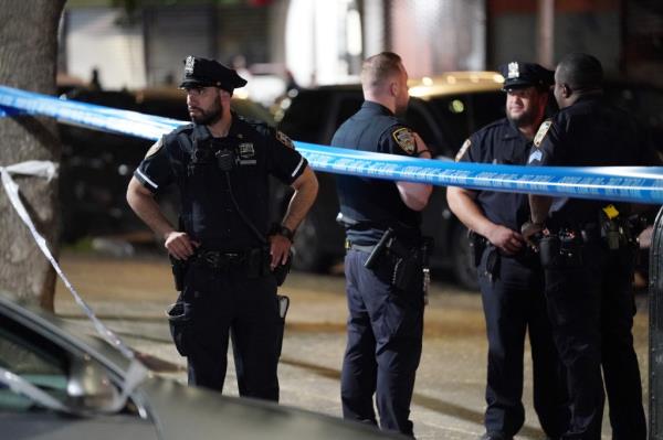 Police at the scene wher<em></em>e a person was reportedly fatally shot on E118th Street at Lexington Avenue in New York, NY around 11:35 p.m. on July 22, 2023.