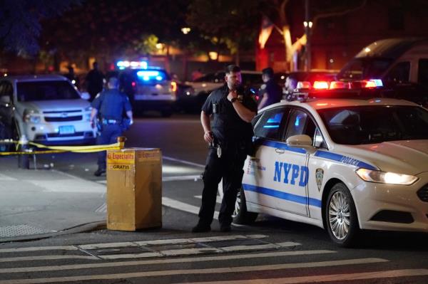 Police at the scene wher<em></em>e a person was shot on E115th Street at Third Avenue in New York, NY around 12:30 a.m. on August 6, 2023. 