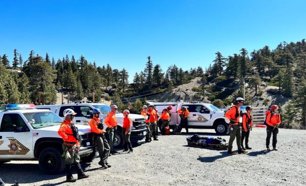 Volunteers and officials arrive to co<em></em>ntinue its search for actor Julian Sands on June 17.