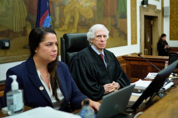 Judge Arthur Engoron, right, sits on the bench with principal law clerk Allison Greenfield, before the start of proceedings in a civil business fraud trial against the Trump Organization at New York Supreme Court, Thursday, Dec. 7, 2023, in New York.    