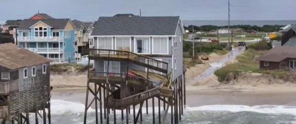 A deck hanging off Sharon Troy's house. 
