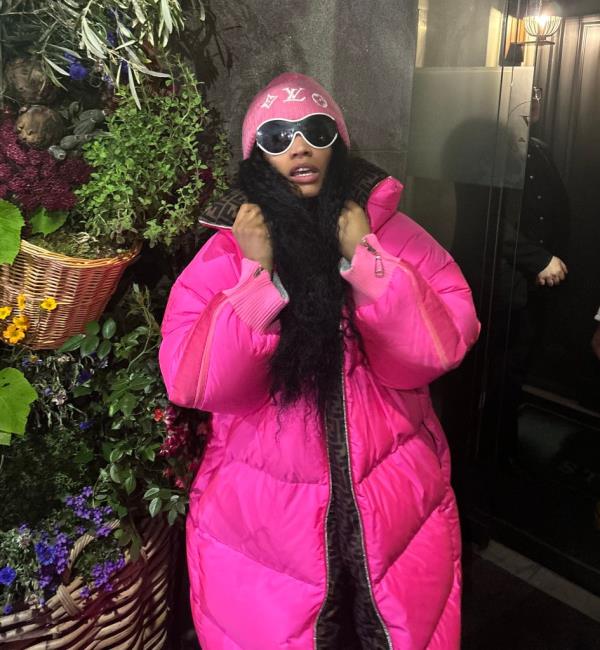 American rapper Nicki Minaj in a pink coat, seen arriving in the UK after her drug arrest in Amsterdam during her Pink Friday 2 World Tour.