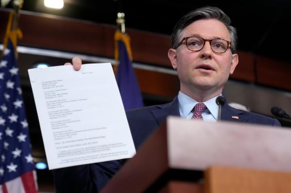 House Speaker Mike Johnson of La., holds a letter from retired FBI executives as he speaks a<em></em>bout border policy during a press co<em></em>nference on Capitol Hill, Tuesday, Jan. 30, 2024 in Washington