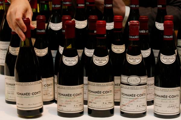 Display of 55 bottles of Domaine de la Romanee Conti's Romanee Co<em></em>nti wine from 1952 to 2007 at an auction preview in Hong Kong