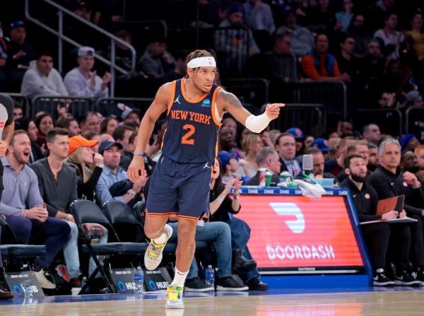 Miles McBride #2 of the New York Knicks reacts on the court after hitting a three point shot during the third quarter.
