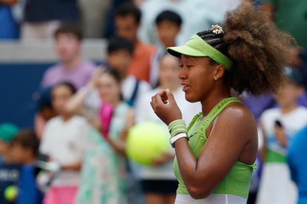 Naomi Osaka (JPN) reacts while walking to her on court interview after her match against Jelena Ostapenko (LAT)(not pictured) in a women's singles match on day two of the 2024 U.S. Open tennis tournament at USTA Billie Jean King Natio<em></em>nal Tennis Center.
