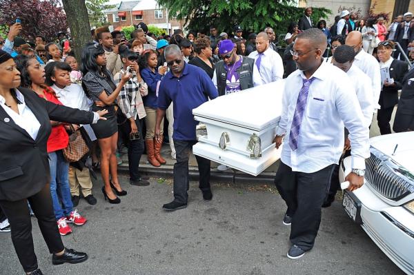 The casket co<em></em>ntaining 14 year old D'Aja Robinson is carried out of the Greater Allen A.M.E. Cathedral by friends and family after funeral services co<em></em>nclude for the young girl who was shot in the head while on a MTA city bus. 