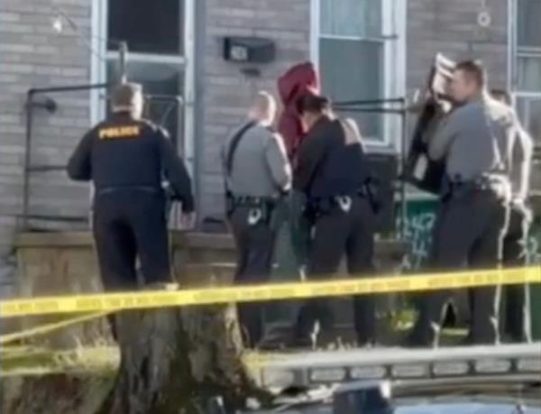 Moyer is seen wearing a red hoodie as he is taken into custody after a stand-off with cops.