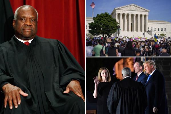 U.S. Supreme Court Justices including Clarence Thomas posing for a group photo at the Supreme Court building on September 29, 2009