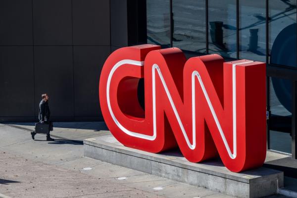 CNN will lay off hundreds of employees in the coming months, according to a report.