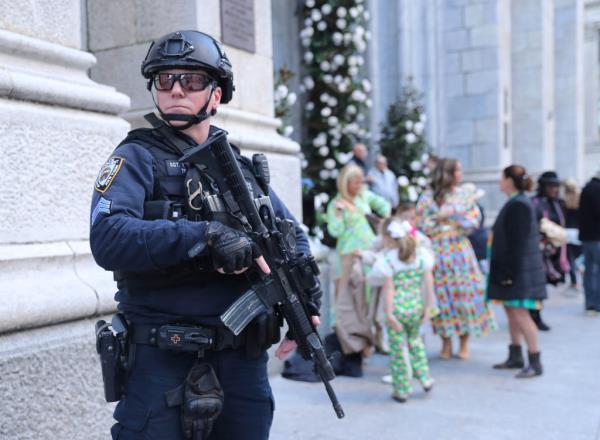 Heavily armed police perso<em></em>nnel statio<em></em>ned outside of St. Patrick's on Easter.