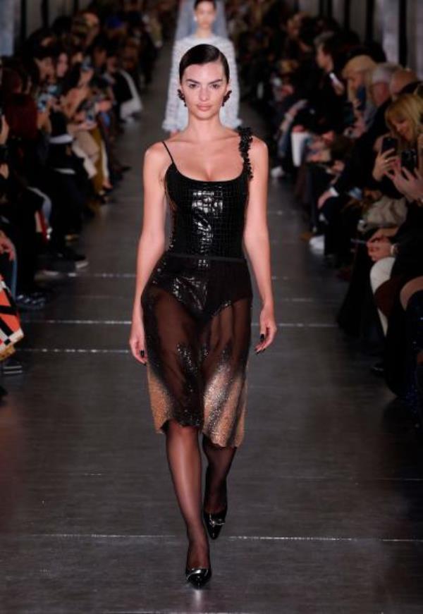 A woman walking down a runway during the Tory Burch show, Fall Winter 2024, New York Fashion Week, USA.
