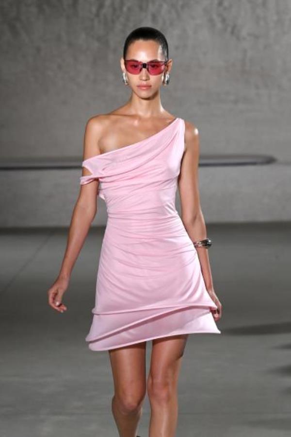 Kiko Mizuhara wearing a pink dress, walks the runway for Tory Burch's Spring/Summer 2024 collection during New York Fashion Week.