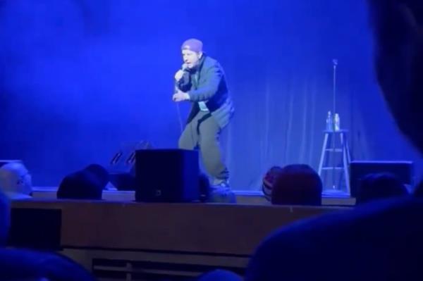 Nick Swardson talking into a mic. 